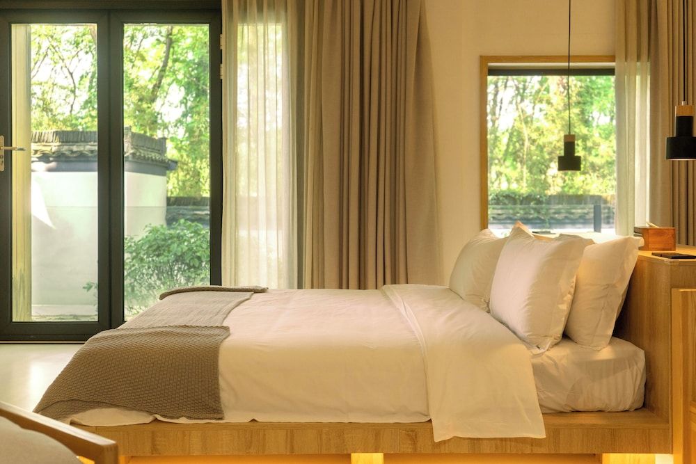 Wangshanlife Snow Garden Design Hotel Deluxe Room, Balcony, Courtyard View 3