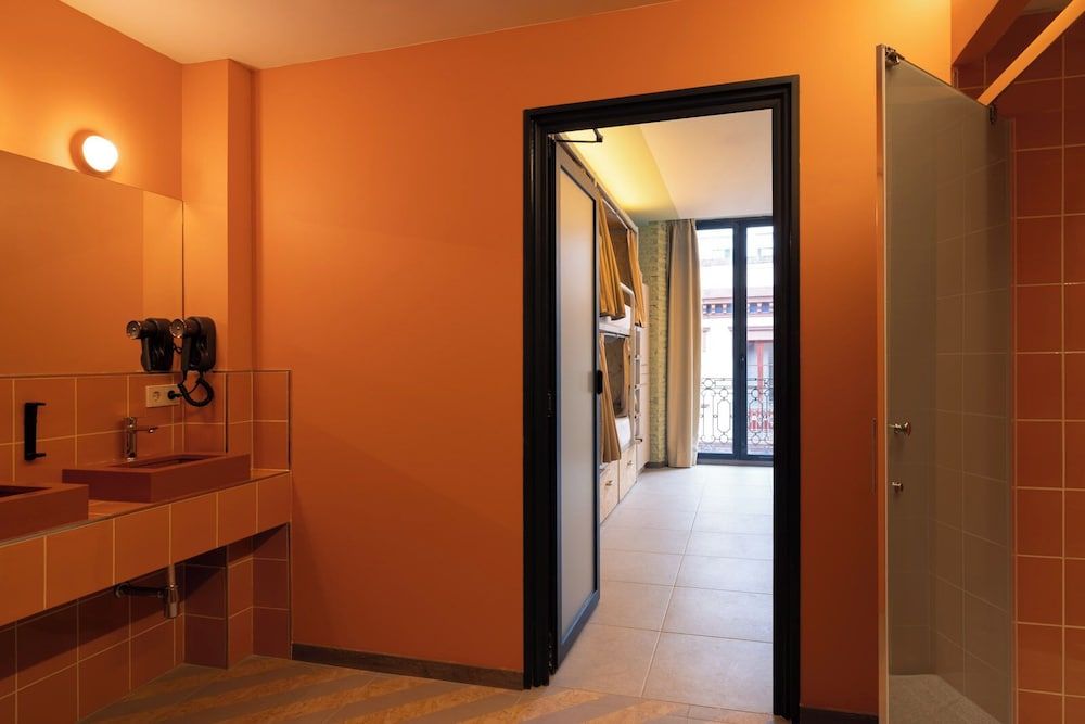 Bed in 8-bed female dormitory room