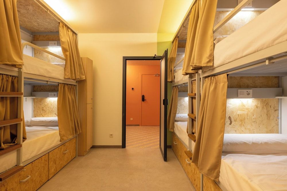 Bed in 8-bed female dormitory room