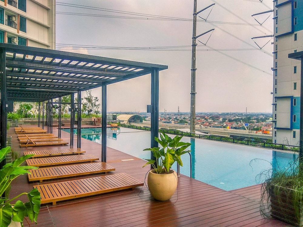 Simple White Designed Studio At Lrt City Bekasi Apartment