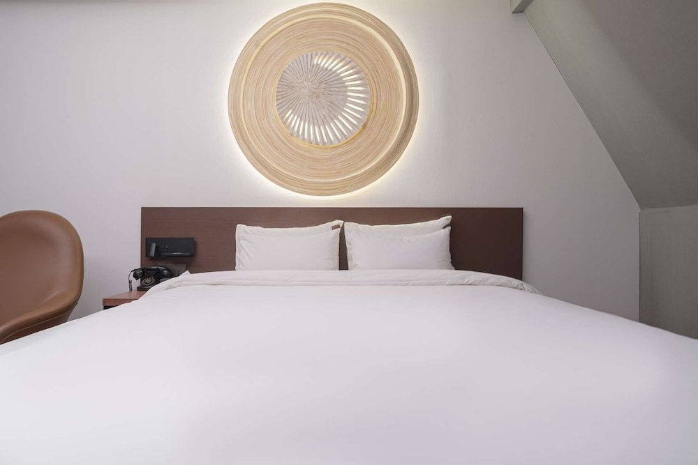 From H About Hotel Chungju Deluxe Room 6