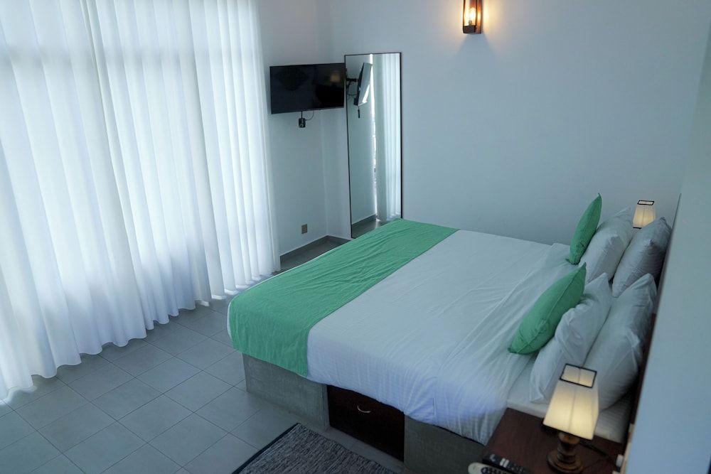 Aaradhya Madu Ganga Deluxe Double Room, Balcony, Garden View 2