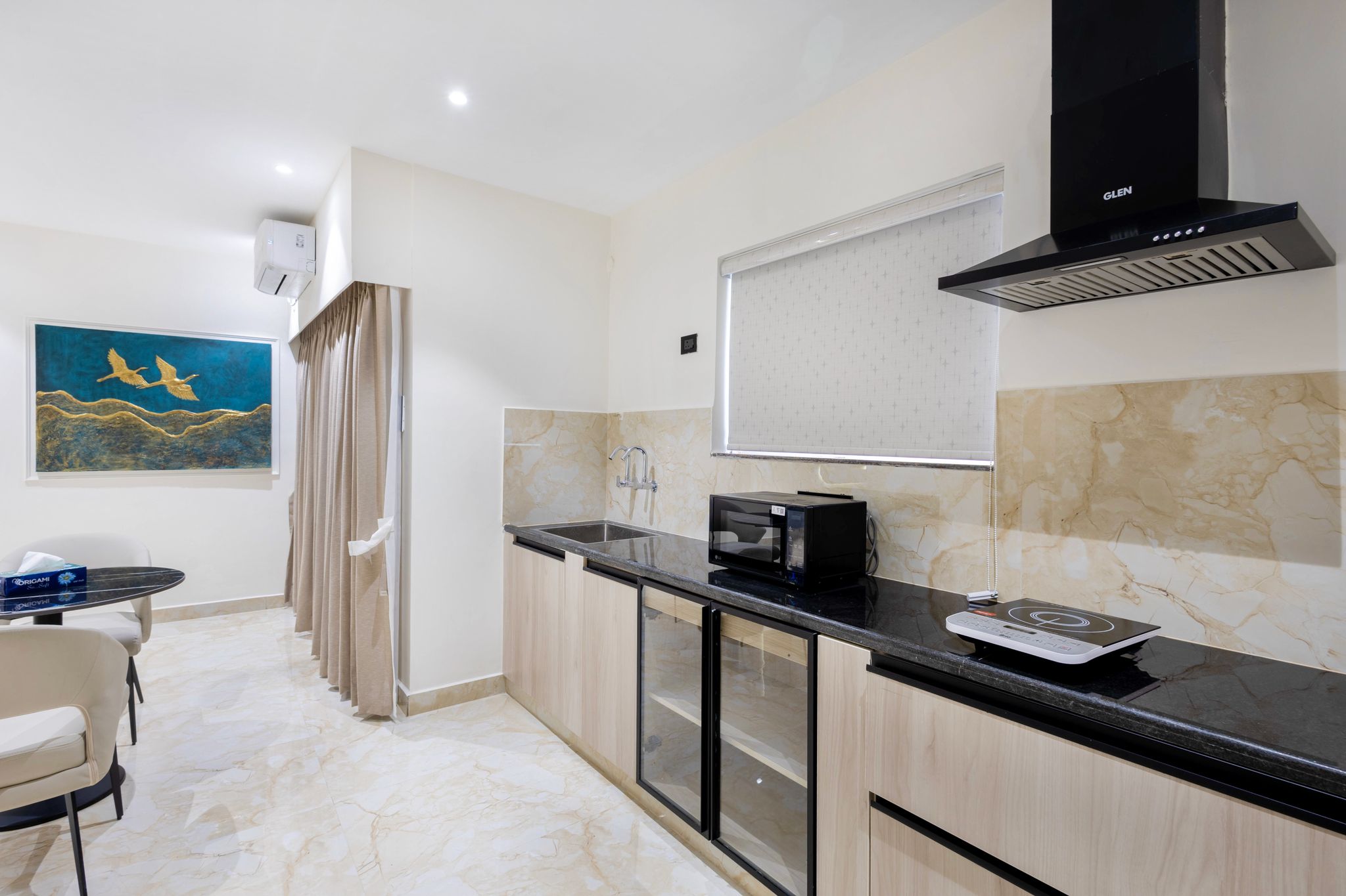 Elysium Premium Suites Madhapur Premier Balcony Suite with kitchenette and Living room 10