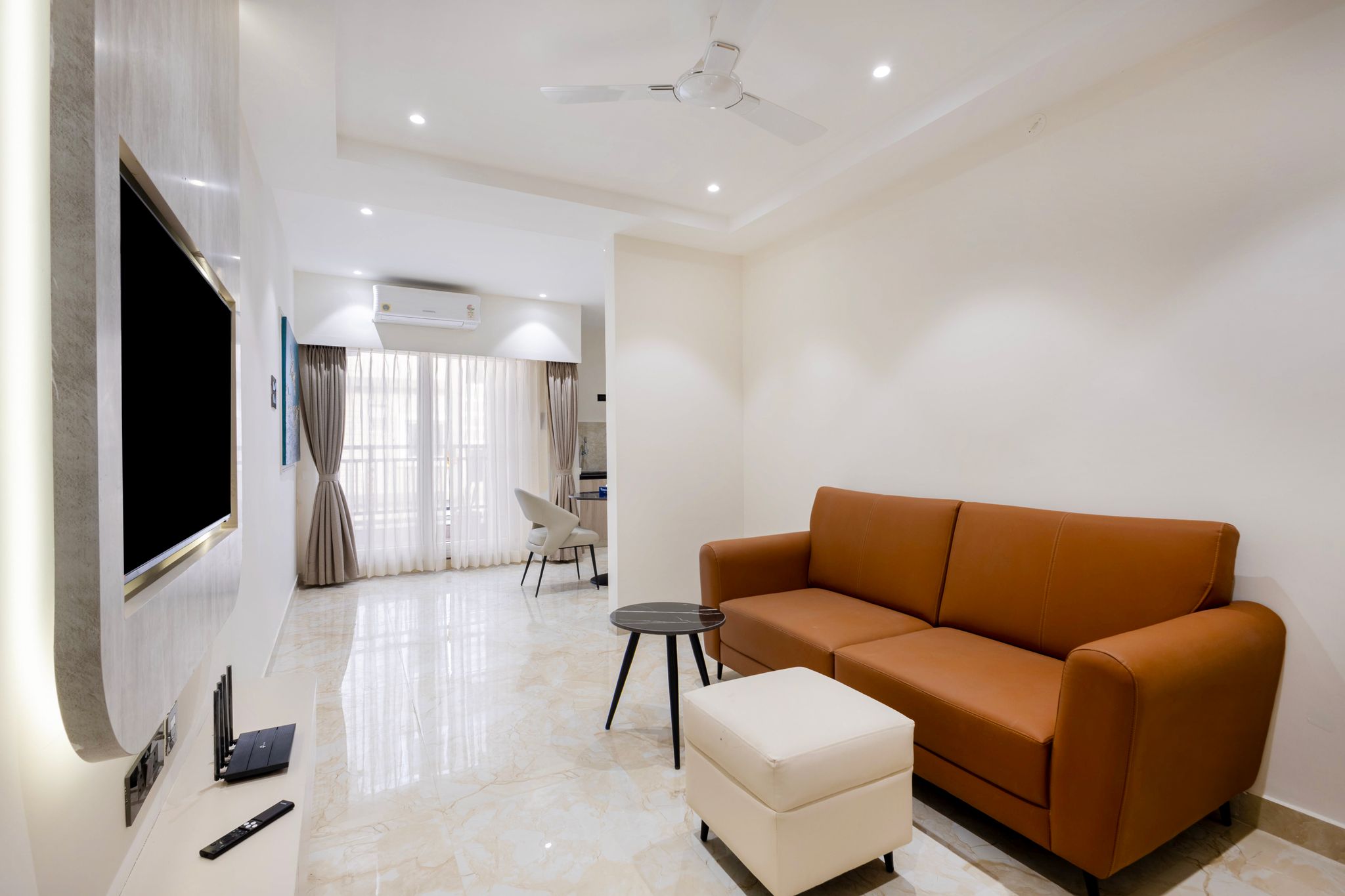Elysium Premium Suites Madhapur Premier Balcony Suite with kitchenette and Living room 4