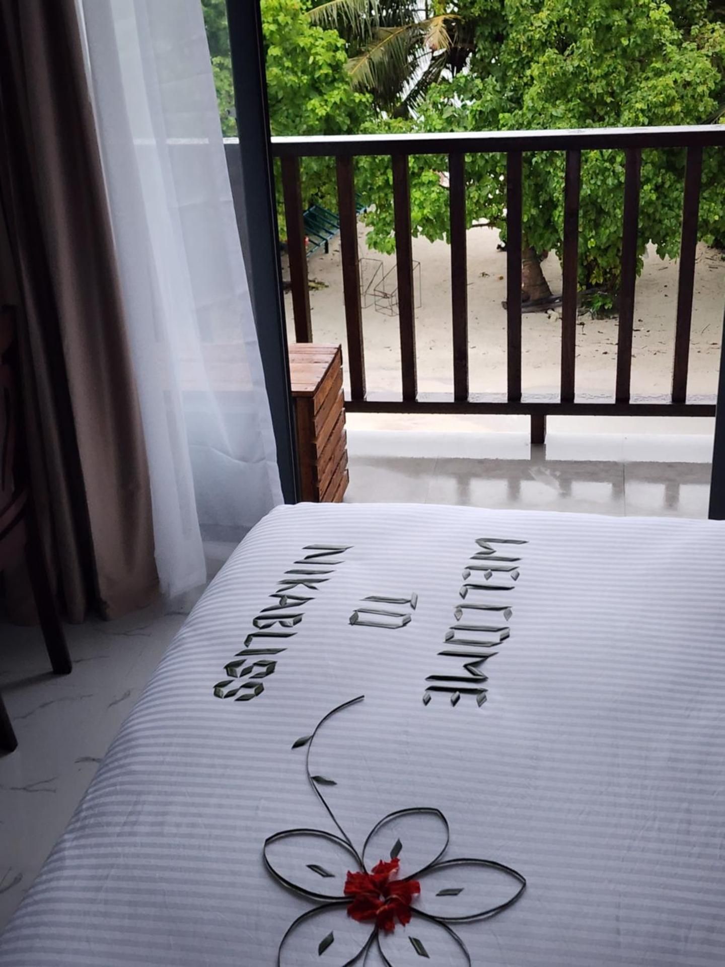 Nikabliss Dhigurah Deluxe Double Room with Balcony and Sea View 3