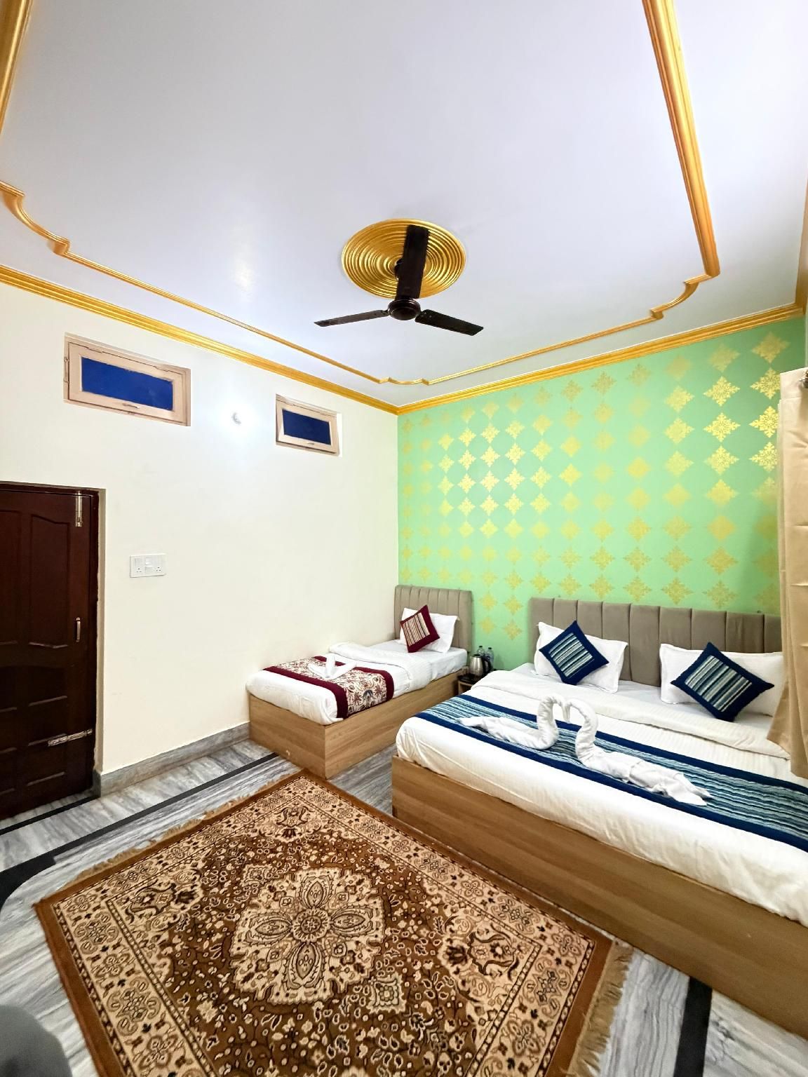 The Unnati Residency Triple Bedroom