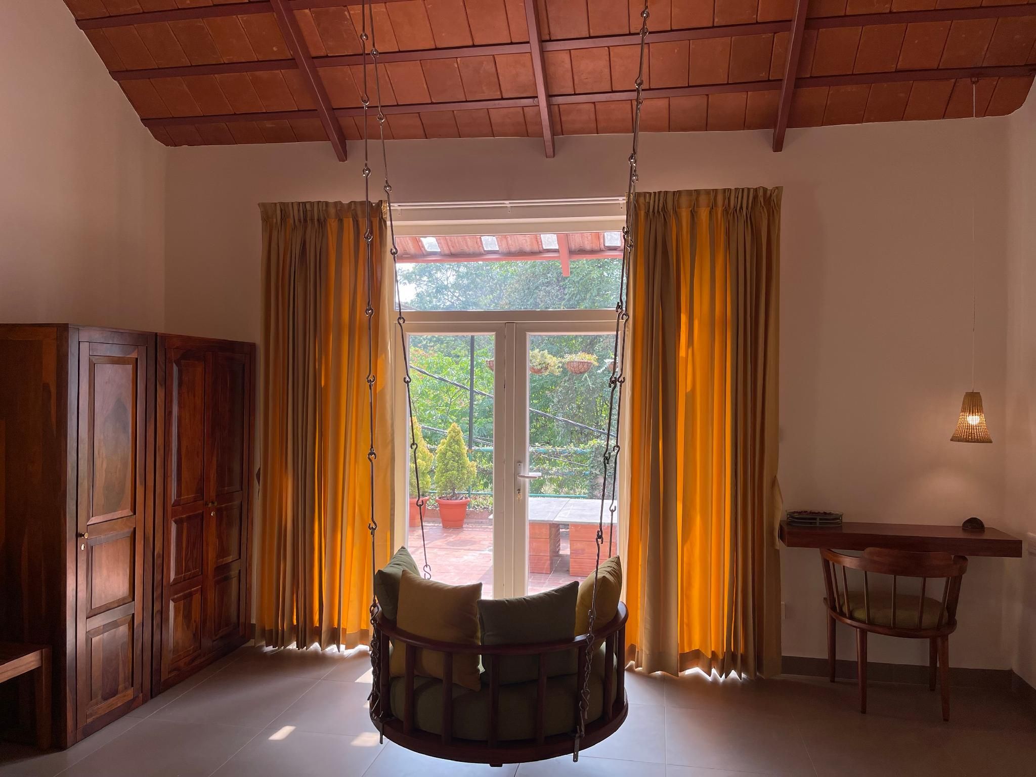 Gokulam Guest House Balcony Classic Garden View 3