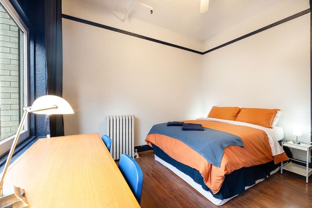 The Guesthouse Vancouver Downtown Pet Friendly Queen Room with Shared Washroom