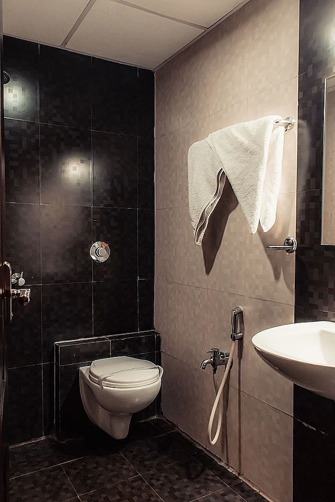 The Signature Inn Deluxe Triple Room, Multiple Beds 2