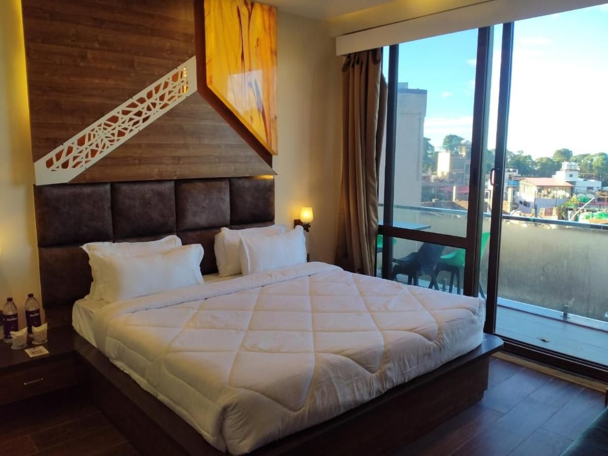 Family suite with balcony - ( Comes with 2 Sofa Cum Bed Extra )