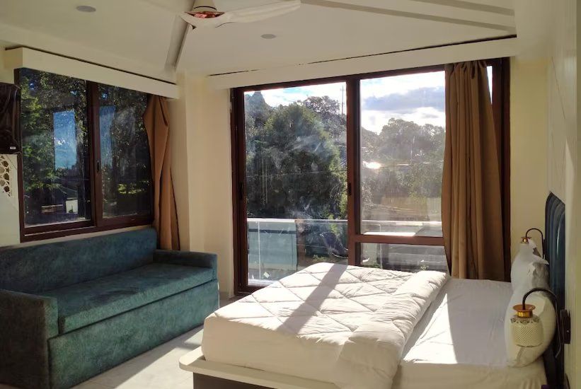Family suite with balcony - ( Comes with 2 Sofa Cum Bed Extra )