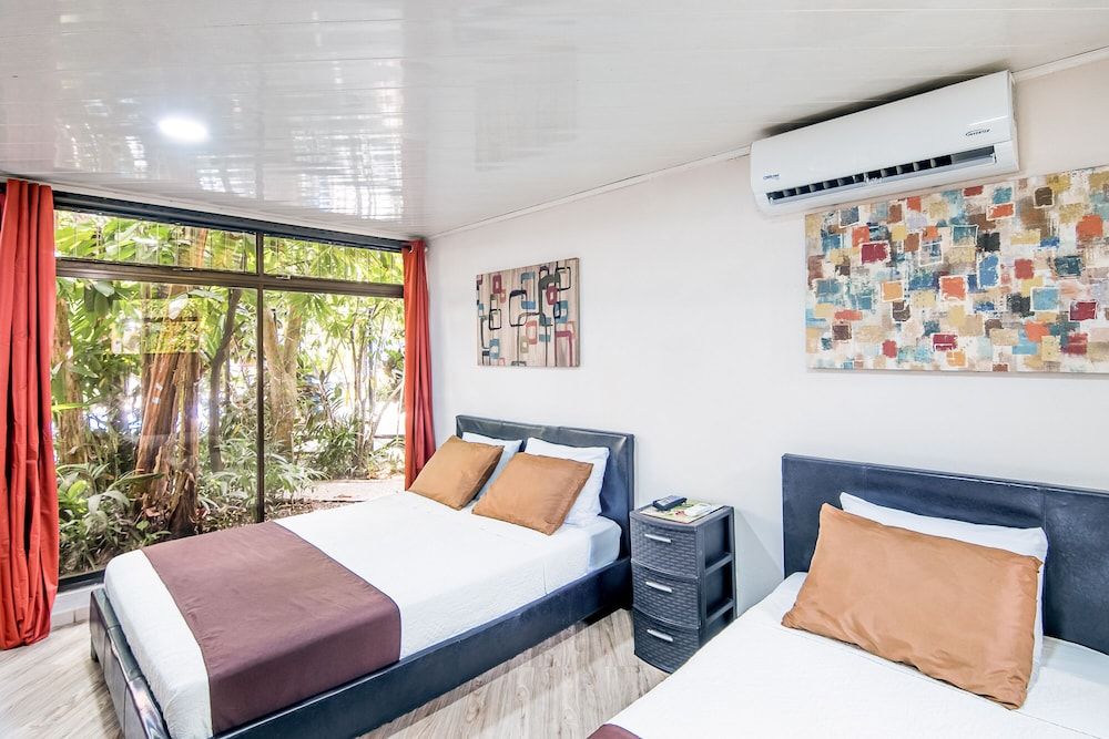 Jaco Lodge Quiet Hotel Double room, Multiple beds, garden area - Pets allowed 5
