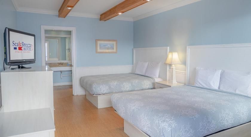 Sea And Breeze Hotel And Condo Queen Room with Two Queen Beds