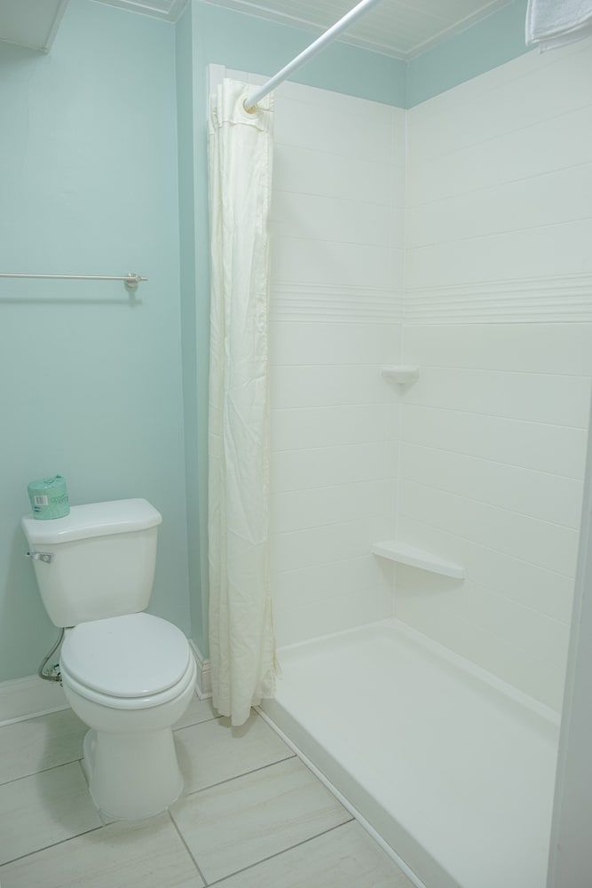 Sea And Breeze Hotel And Condo King Size Bed 5