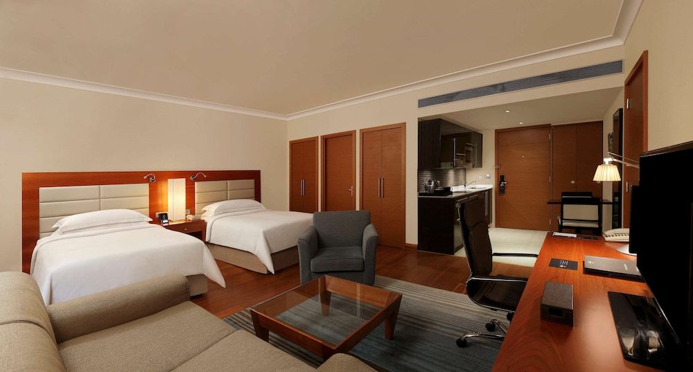 Hilton Bangalore Embassy GolfLinks King Hilton Guestroom with Sofa cum Bed, Bathtub,15% disc on F&B,Spa 4