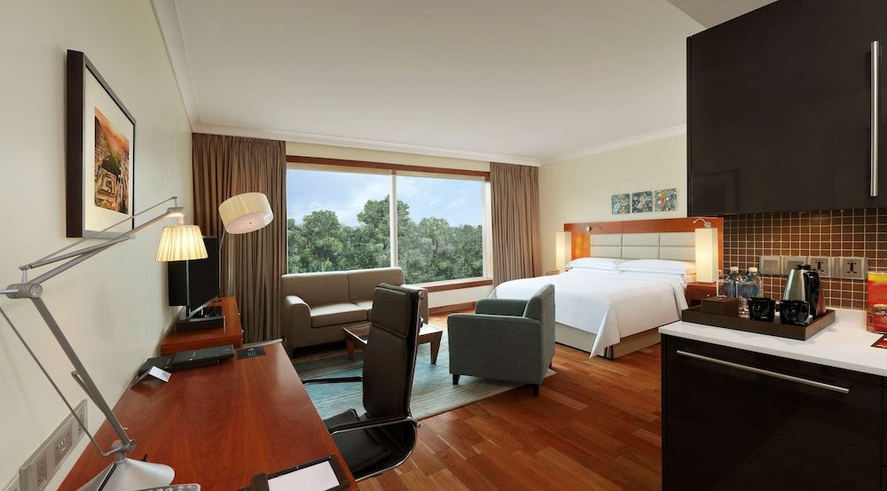 Hilton Bangalore Embassy GolfLinks King Hilton Guestroom with Sofa cum Bed, Bathtub,15% disc on F&B,Spa 6