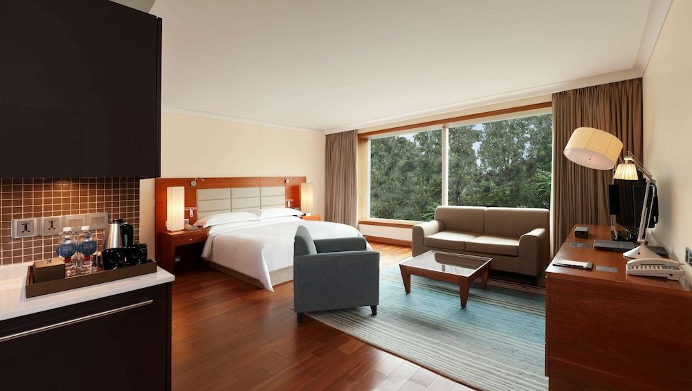 Hilton Bangalore Embassy GolfLinks King Hilton Guestroom with Sofa cum Bed, Bathtub,15% disc on F&B,Spa 9
