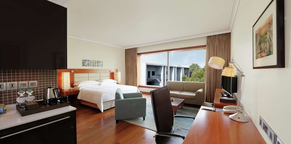 Hilton Bangalore Embassy GolfLinks King Hilton Guestroom with Sofa cum Bed, Bathtub,15% disc on F&B,Spa 7