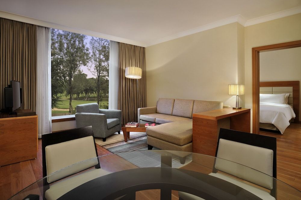 Hilton Bangalore Embassy GolfLinks King Hilton Guestroom with Sofa cum Bed, Bathtub,15% disc on F&B,Spa 2