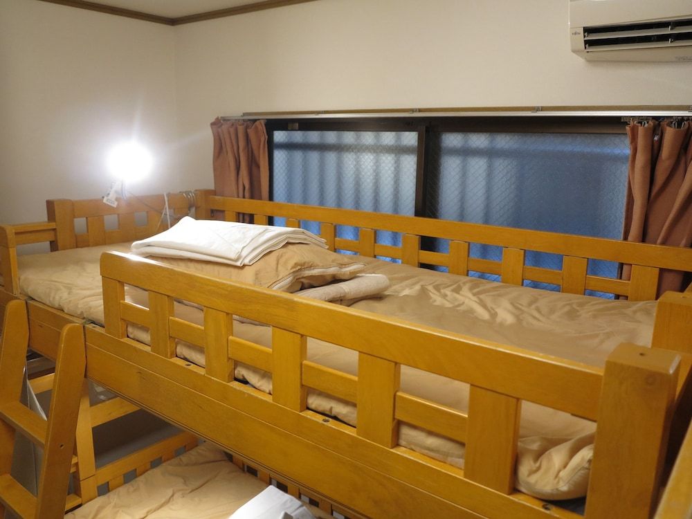Room with bunk beds and shared bathroom