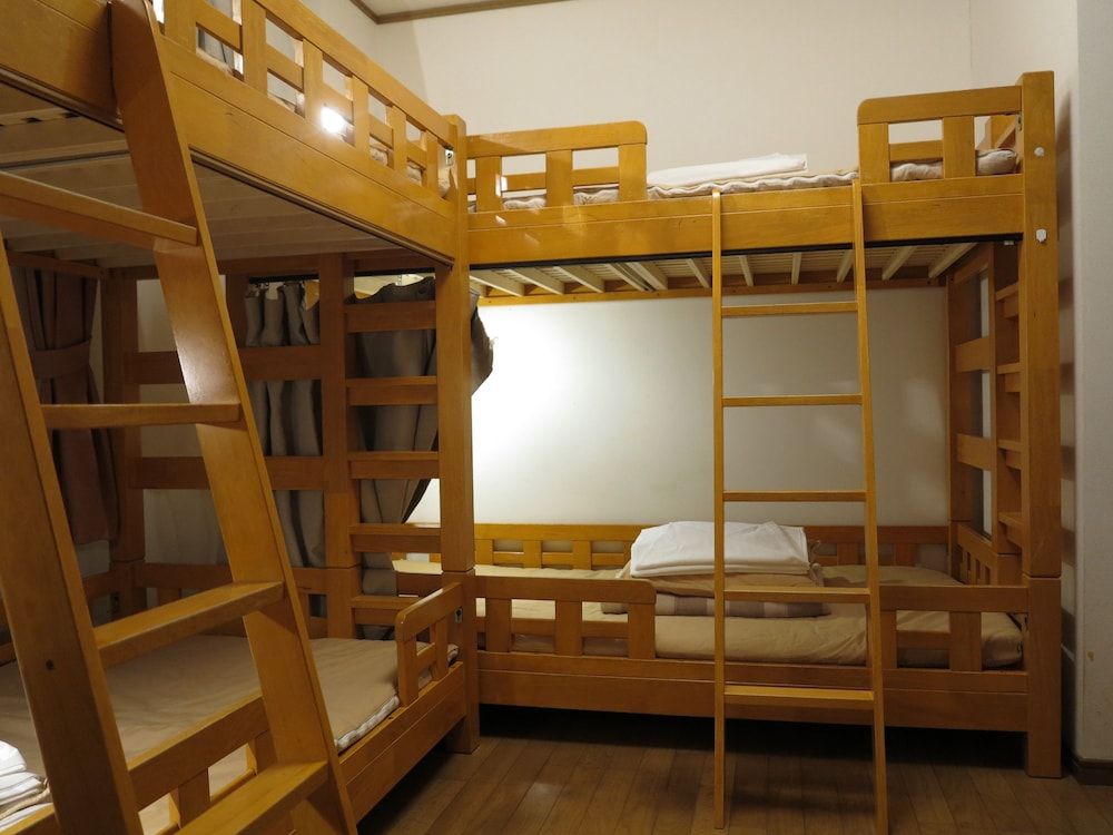 Room with bunk beds and shared bathroom