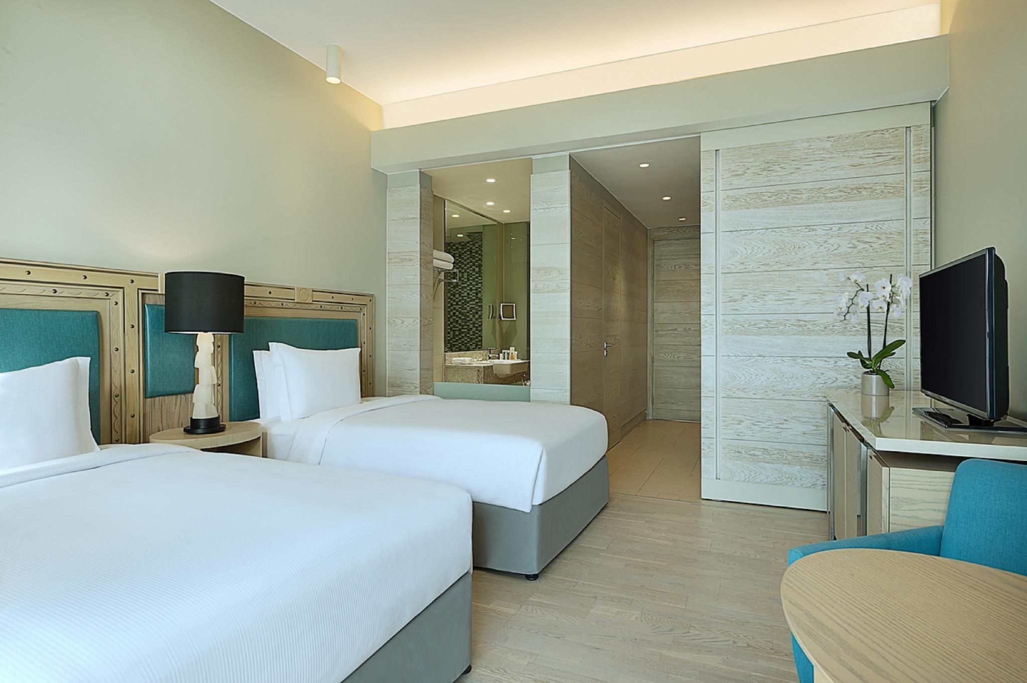 Hilton Dead Sea Resort & Spa Two Double Bed Guest Room 2