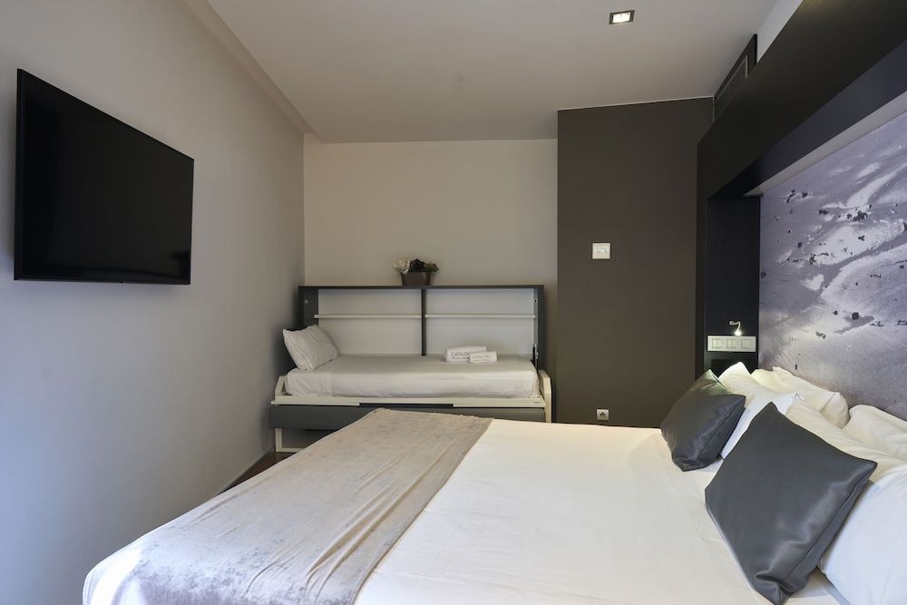 Triple Room (2 adultos + 1 niño)