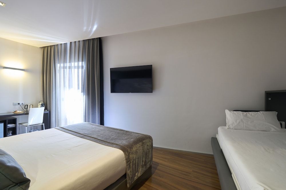 Triple Room (2 adultos + 1 niño)