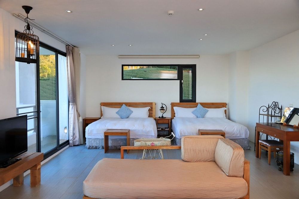 Modern style building- Deluxe Quadruple Room, 2 Queen Beds, Balcony