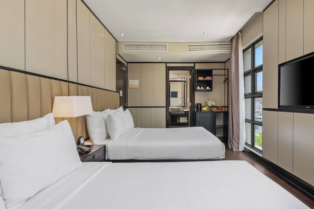 Sanouva Danang Hotel Deluxe Triple Room with afternoon tea daily