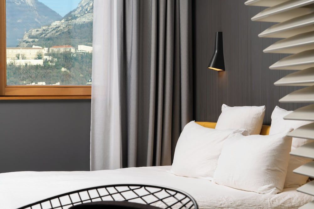 OKKO Hotels Grenoble Centre Classic Mountain View room including self-service snacks and beverages at the Club