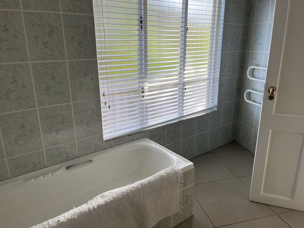 Brenton Beach House Garden and pool view - Standard 6