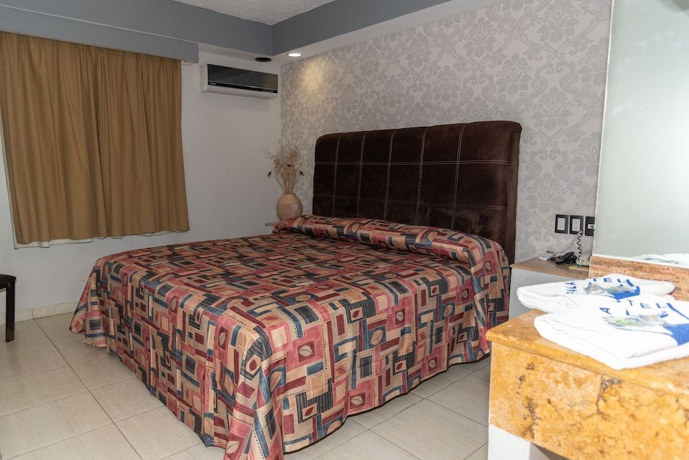 Impala Hotel in front of the ADO Standard Room, 1 King Bed 2