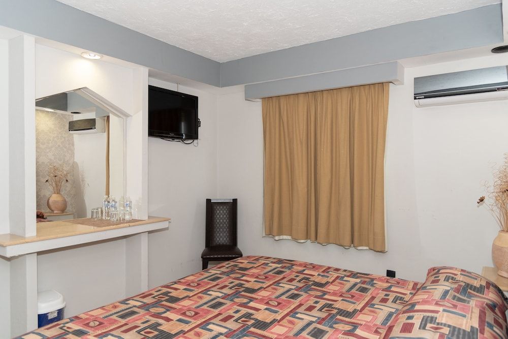 Impala Hotel in front of the ADO Standard Room, 1 King Bed 8